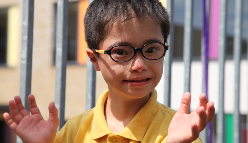 Yusuf, a little boy, wearing glasses