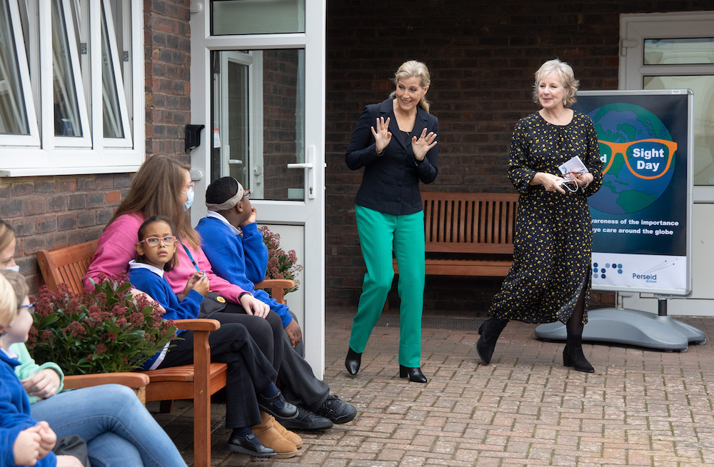 The Countess of Wessex waves hello to children at Perseid School