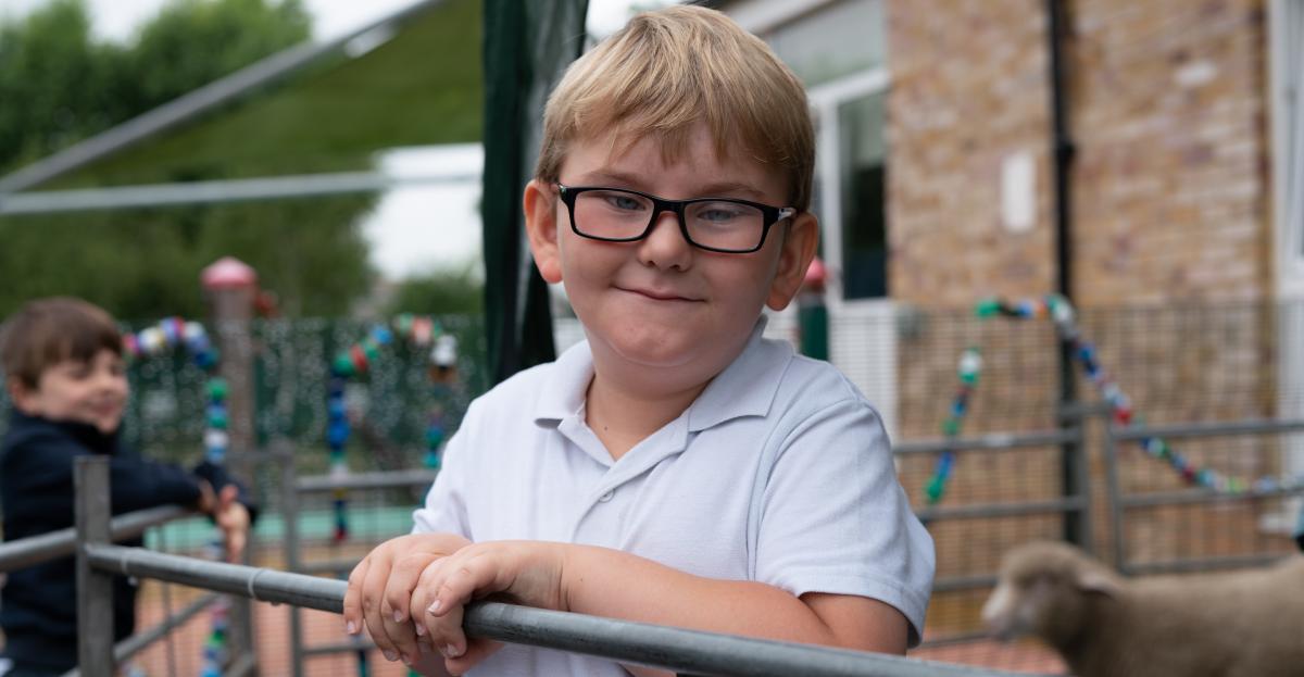 A young boy with glasses 