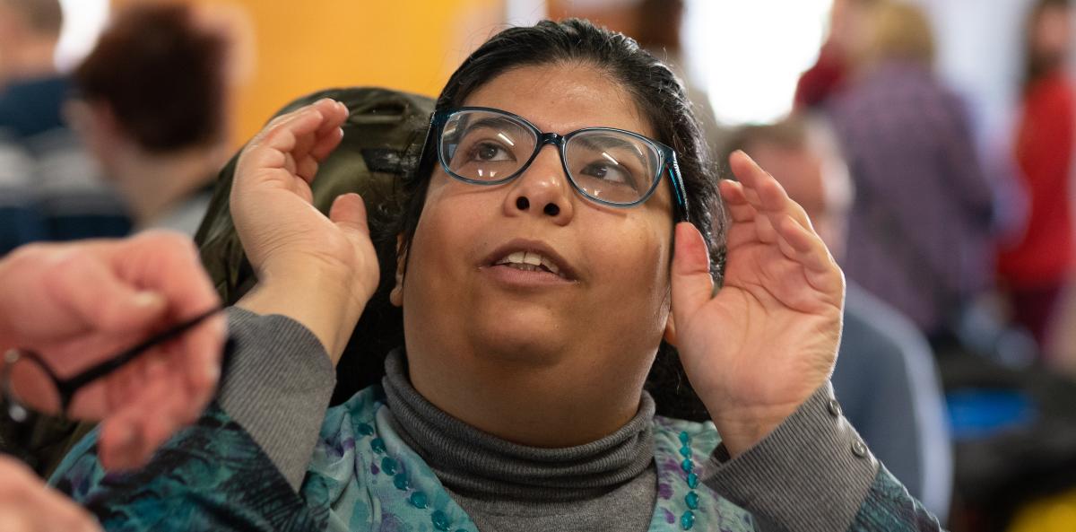 A disabled person wearing glasses