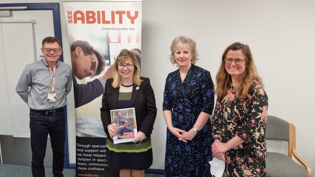 Minister Maria Caulfield with school and eye care staff