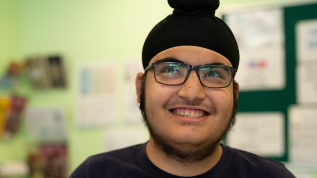 A boy in glasses smiling
