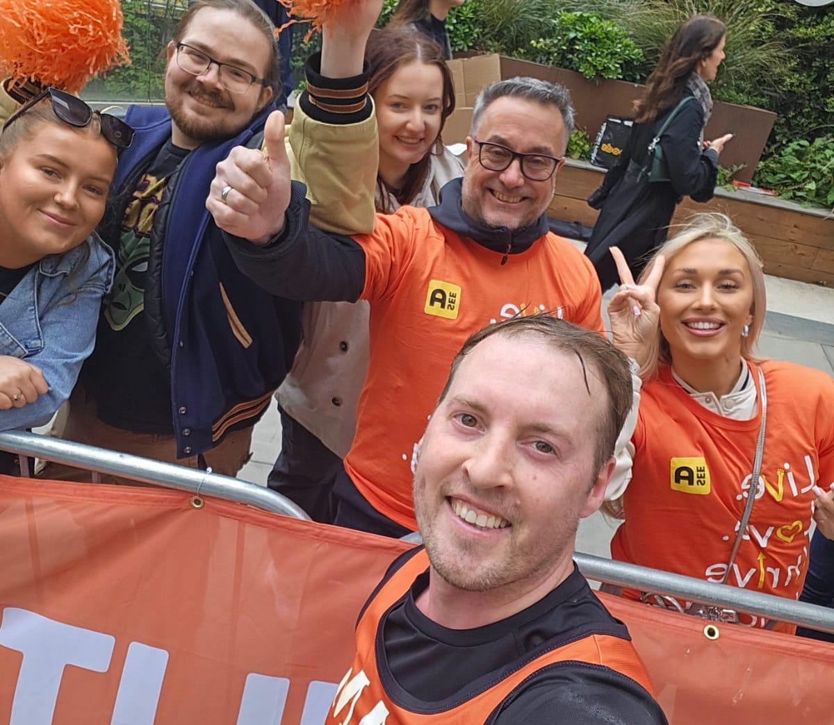 A SeeAbility marathon runner and the cheer squad