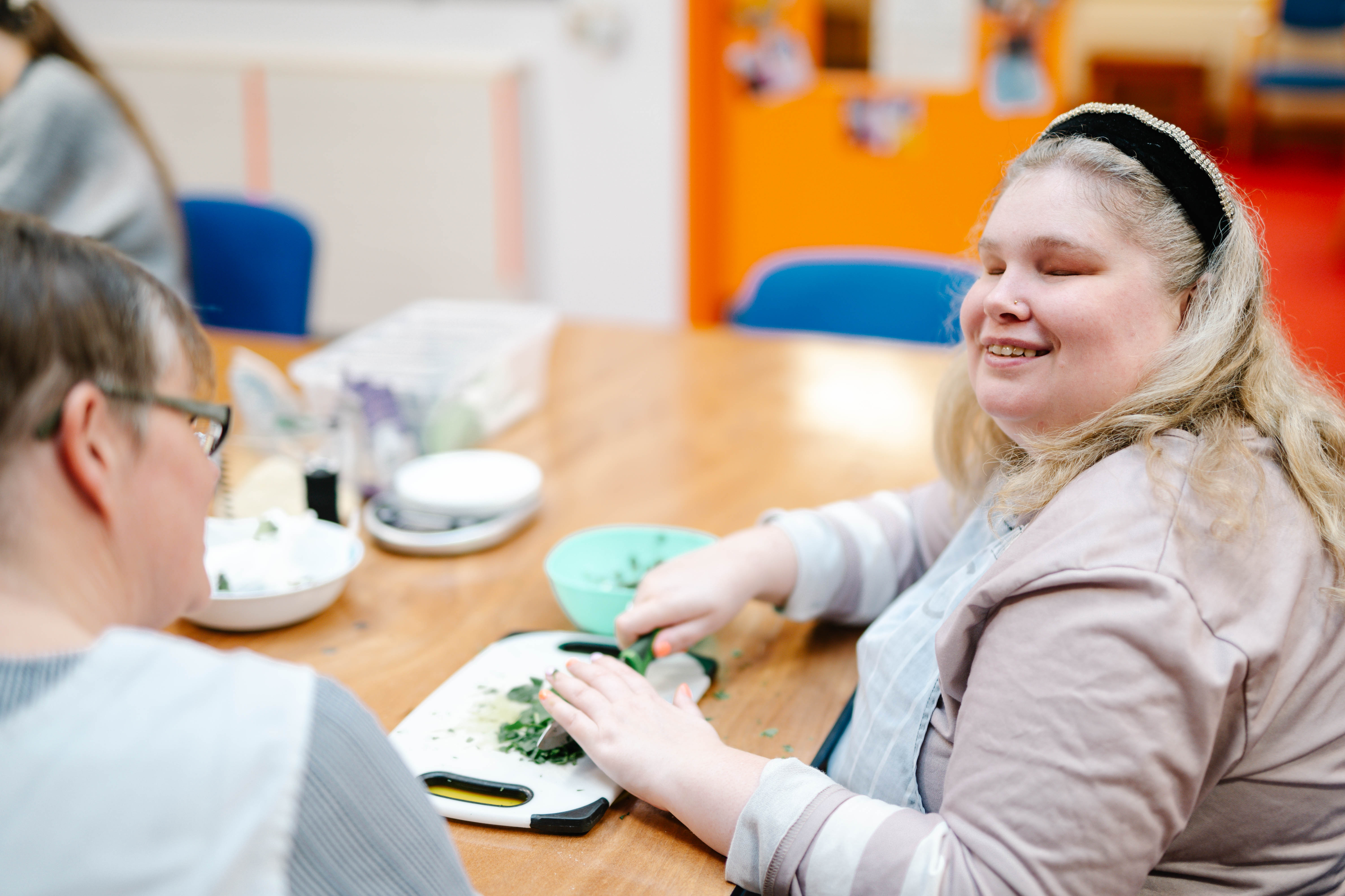 A Support Worker supporting Joanne to prepare her dinner
