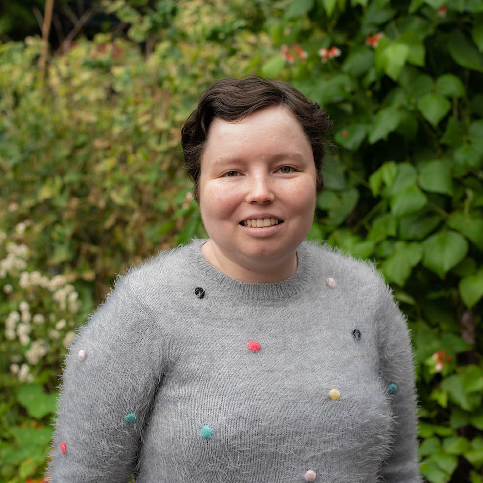 Beatrix smiles at the camera after getting her job