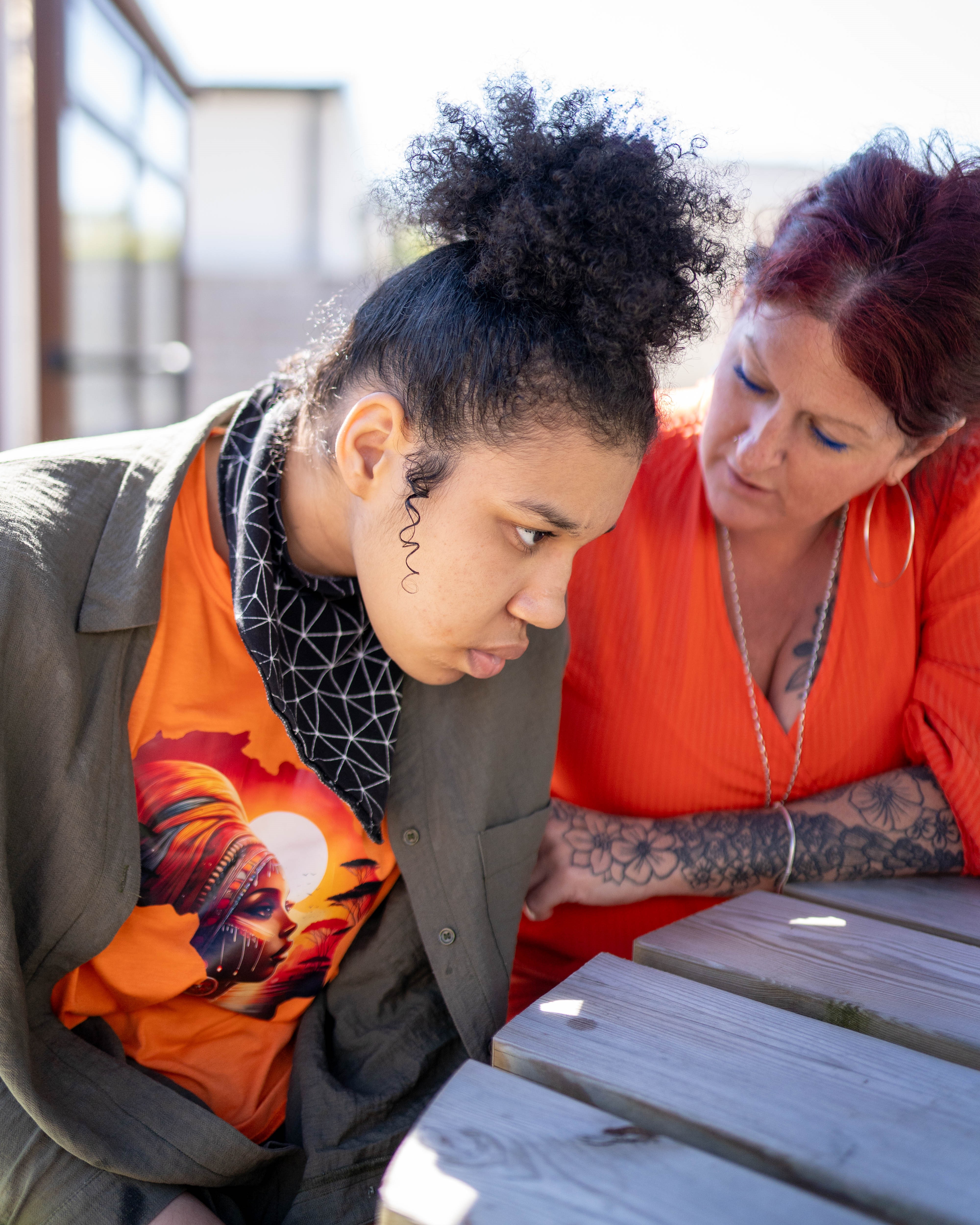 Candace and Rebecca sitting closely 