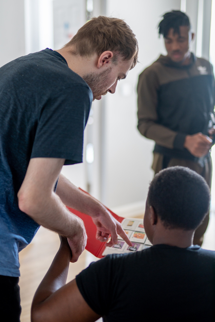 Daniel using his communication book