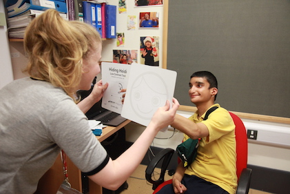 A boy does a kay pictures test