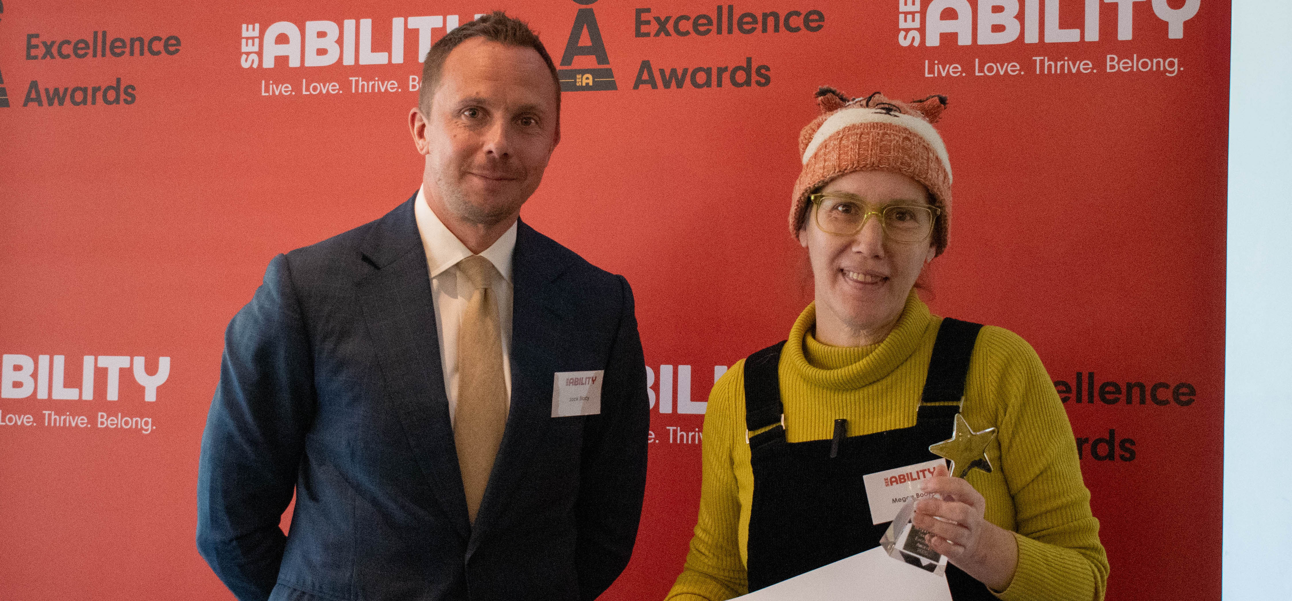 Megan accepts her award