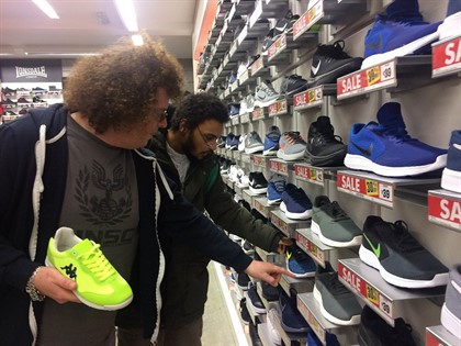 Haillo choosing his new shoes