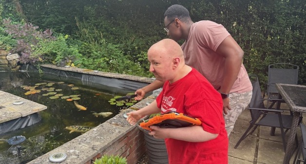 Adam feeding fish