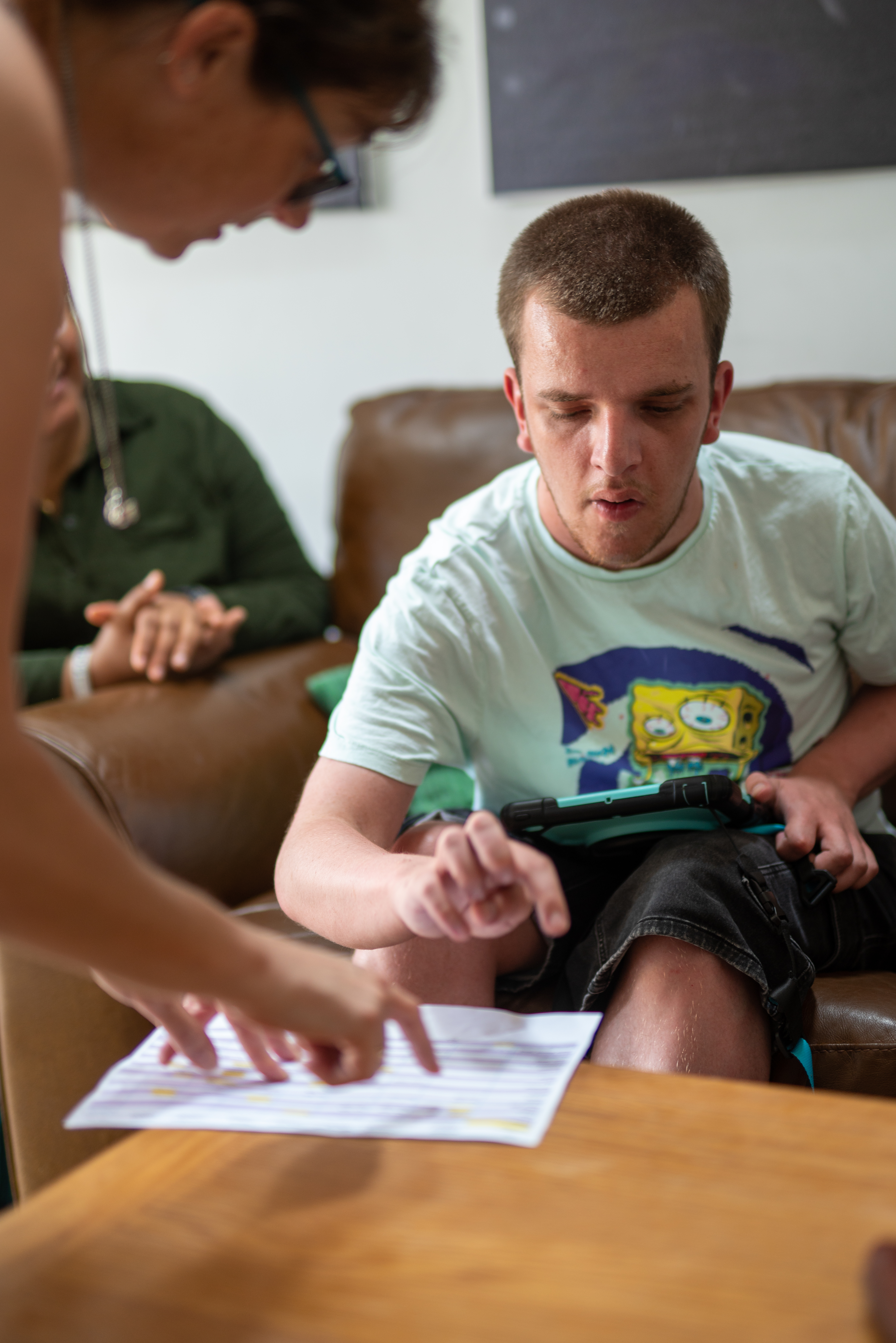 Jake working through a document with a support worker