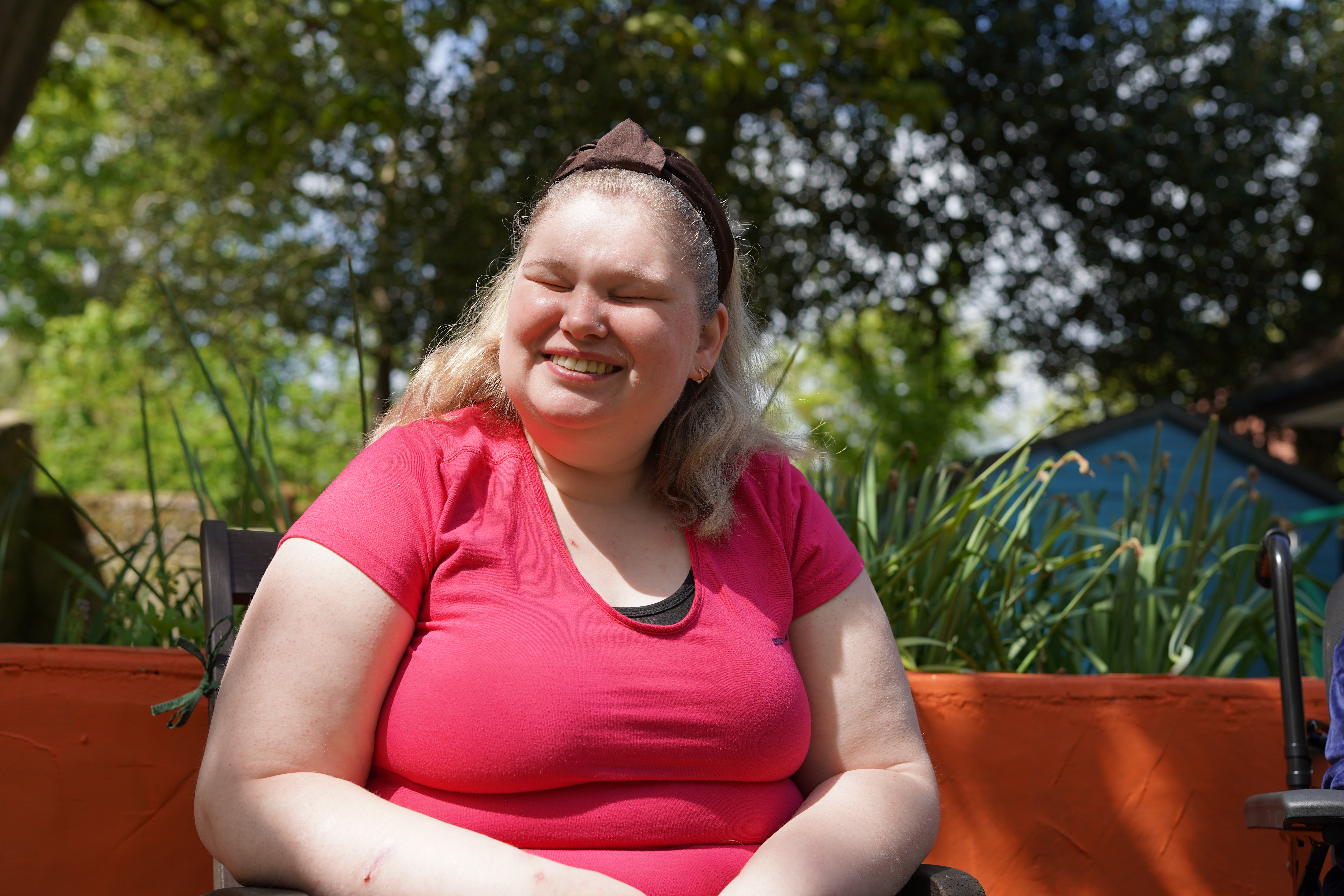 Joanne sitting in the garden