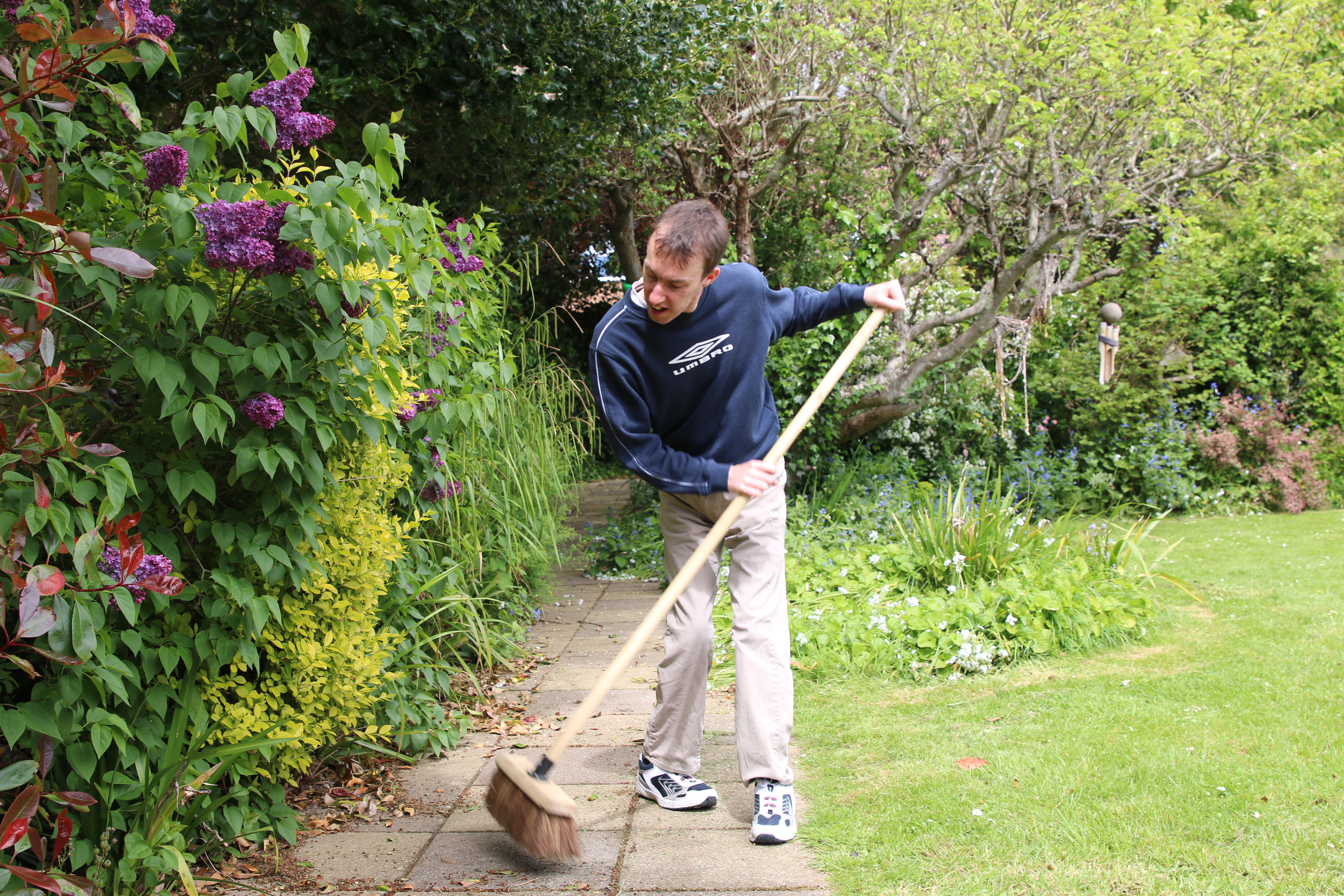 Jordan brushing the garden path