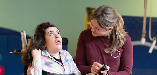 Lizzie with a physiotherapist