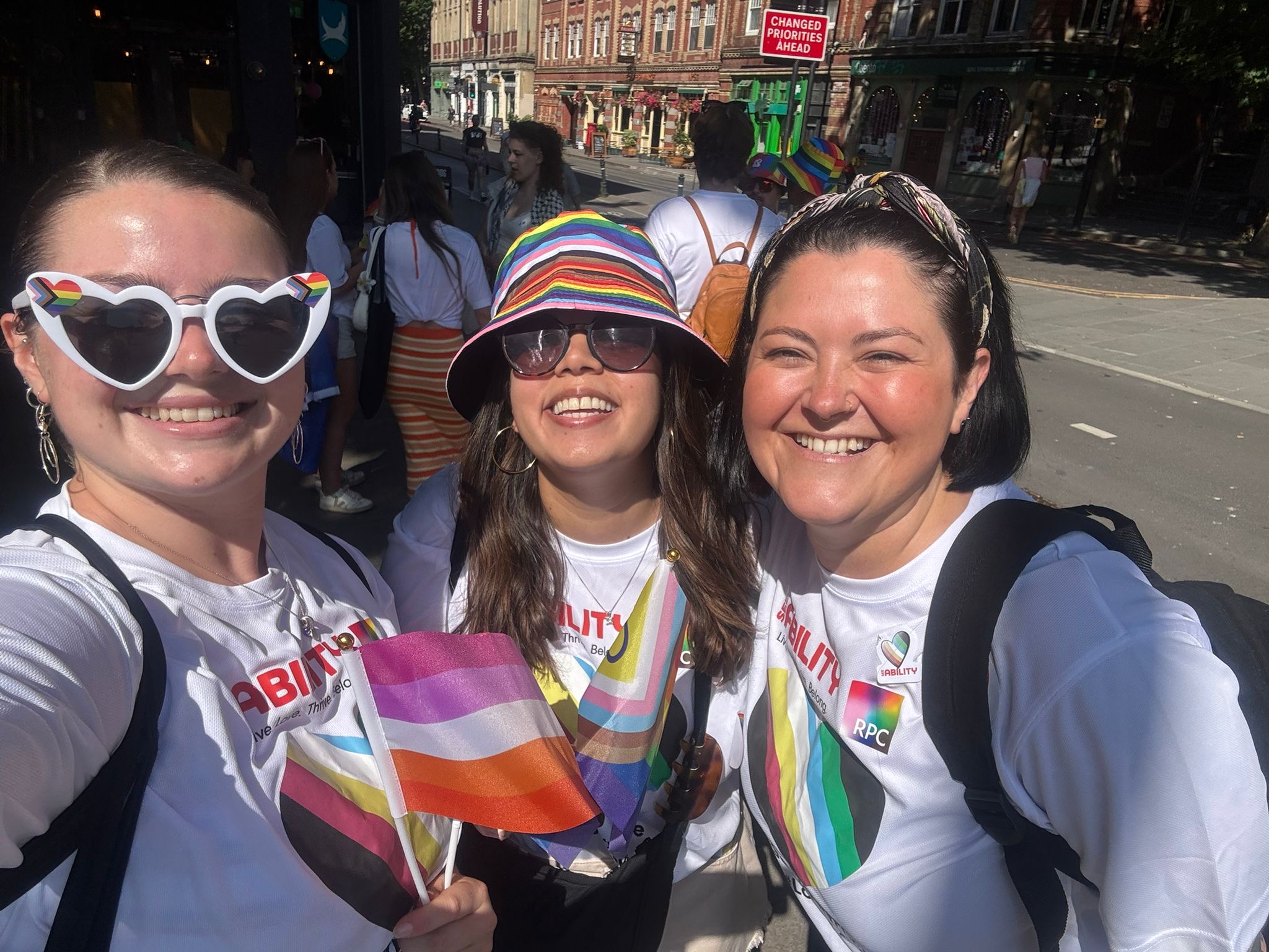 Some of the team pose for a selfie in rainbow accessories