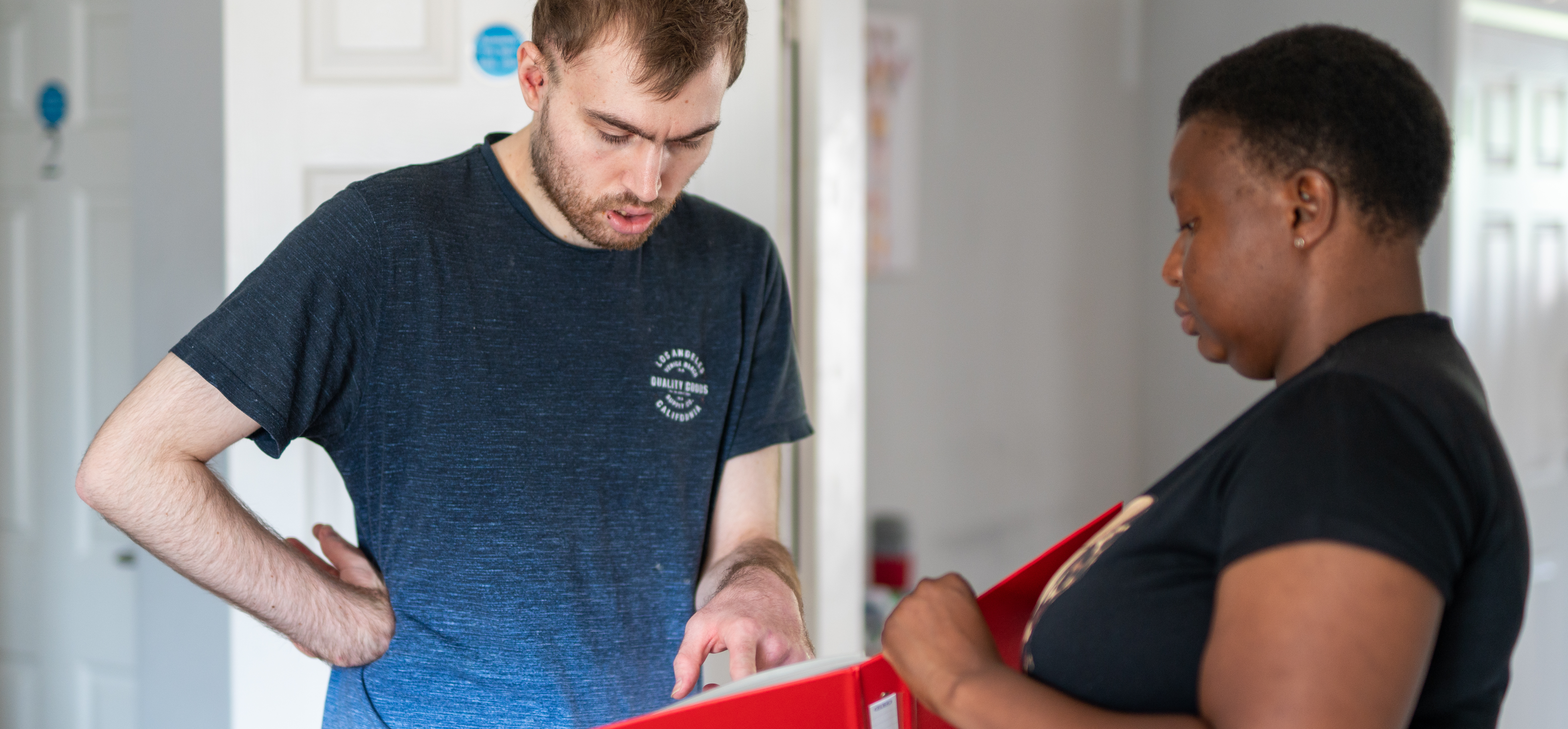 Daniel making a choice from a folder