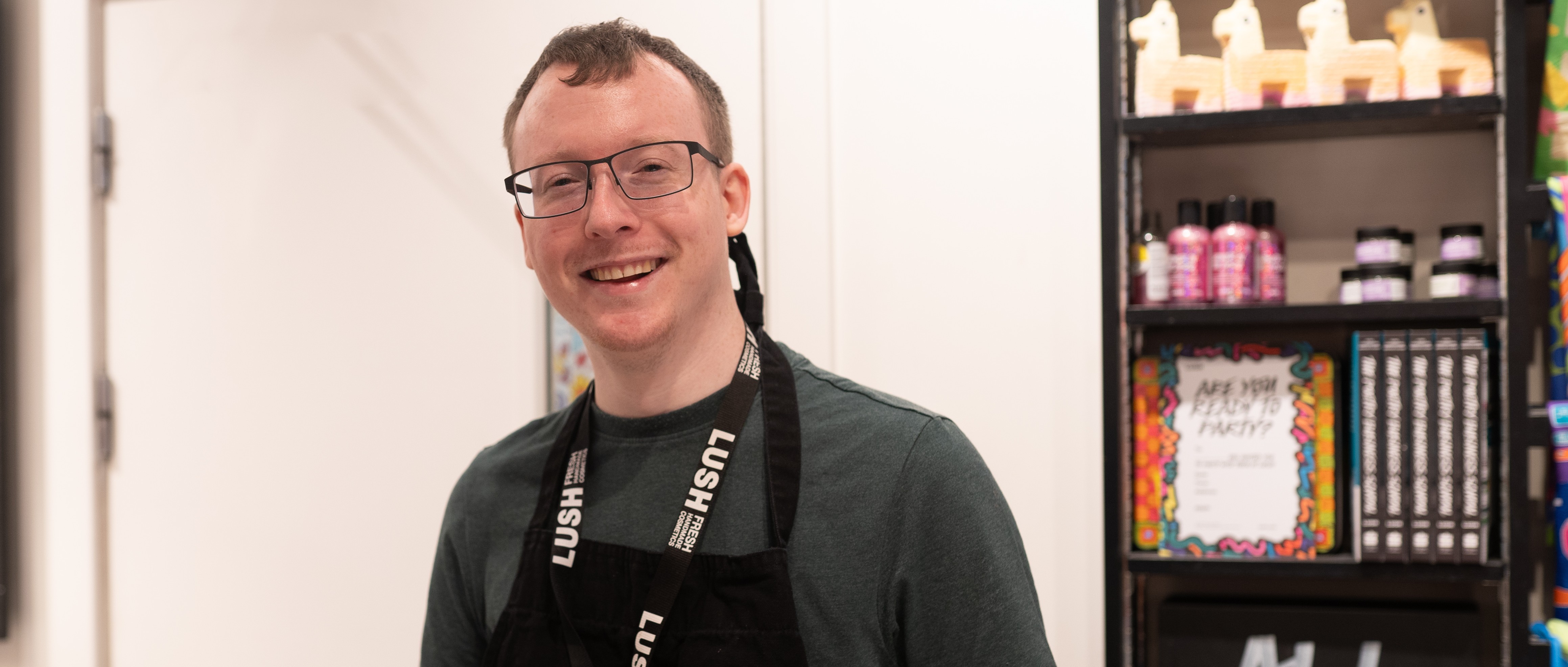 Gary smiling at LUSH, where he now works