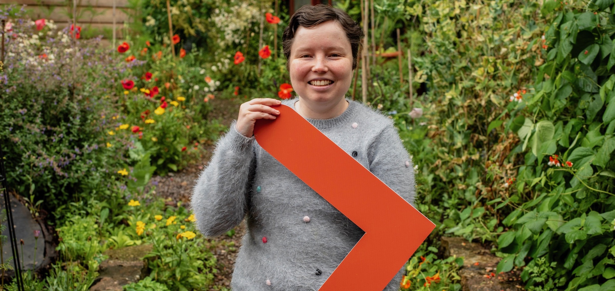 Beatrix holding the Ready, Willing and Able arrow