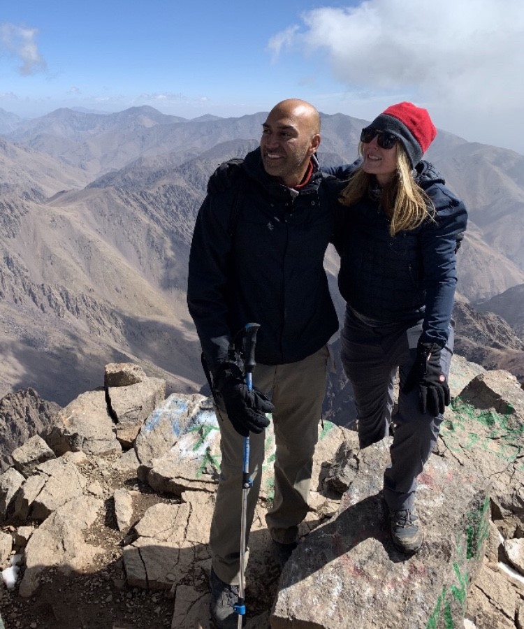 Amar standing on a mountain