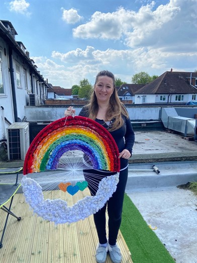 A woman holding a rainbow