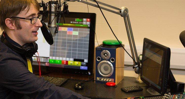 Ian sitting at his computer