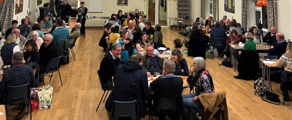 People sitting around tables at the quiz night