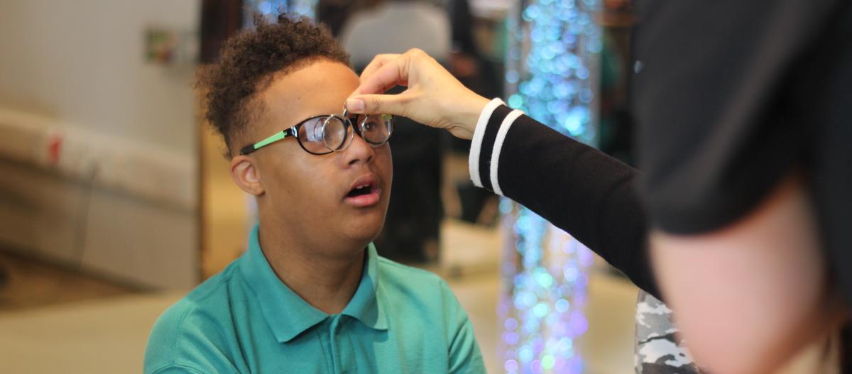 A boy having a sight test