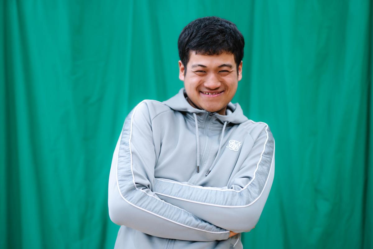 Giban crossing his arms and doing a cheeky smile at the camera