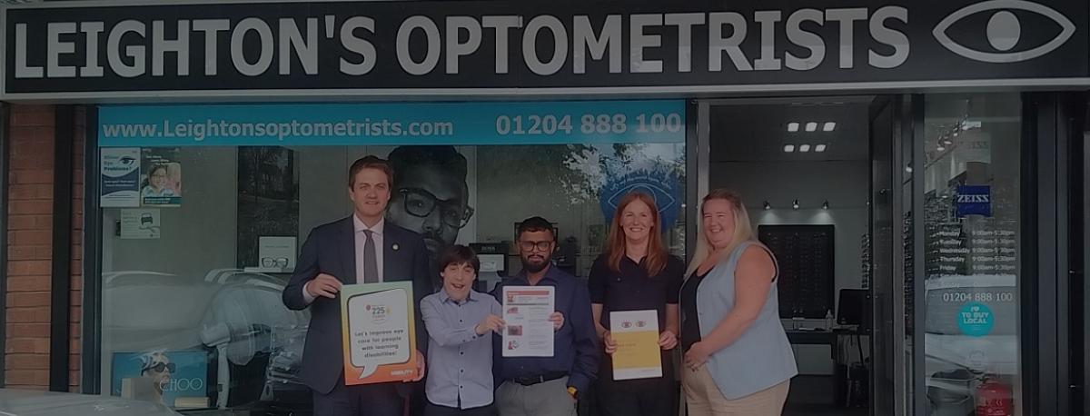 James Frith and the SeeAbility and Leightons teams outside the Opticians