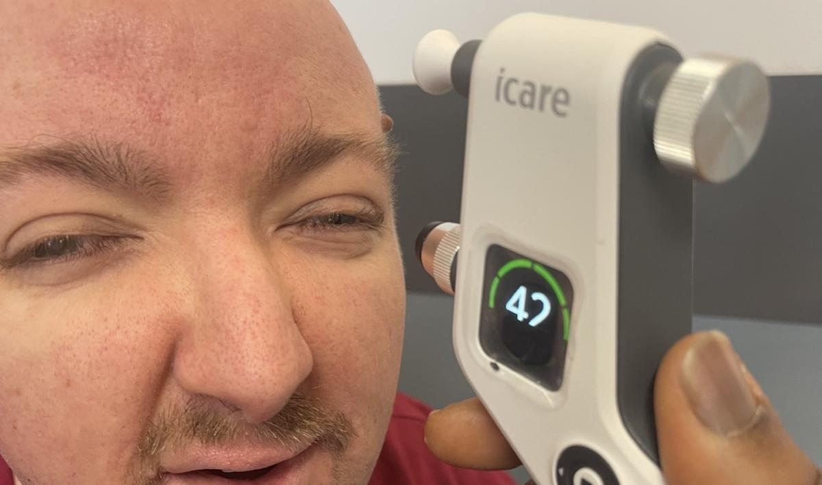 Adam having an eye test