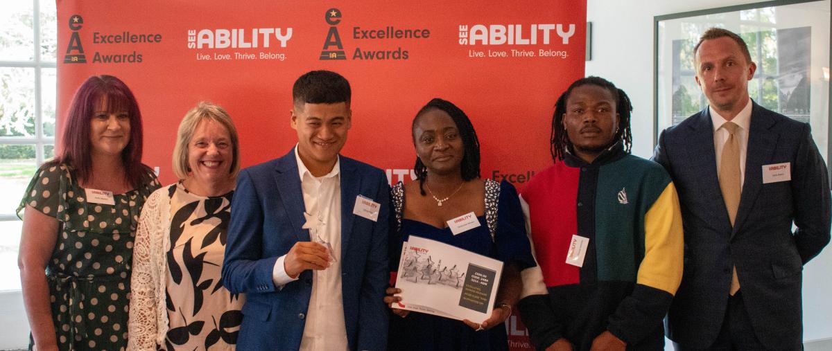 Giban's team accept their award