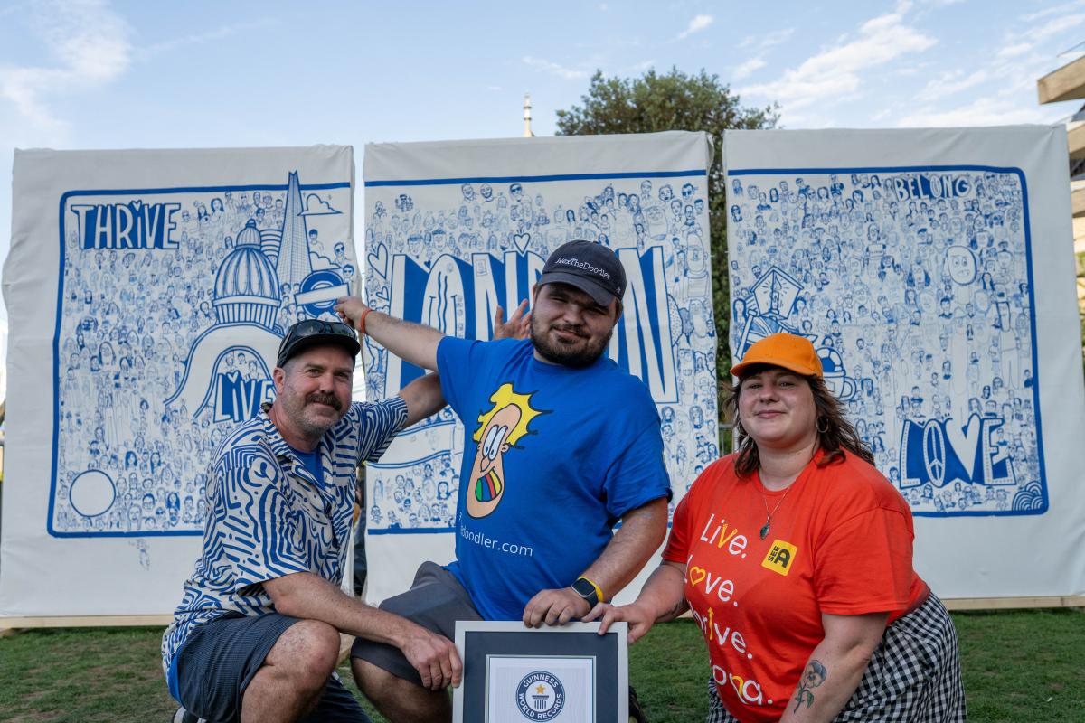 Luke, Alex and Georgie in front of the mural