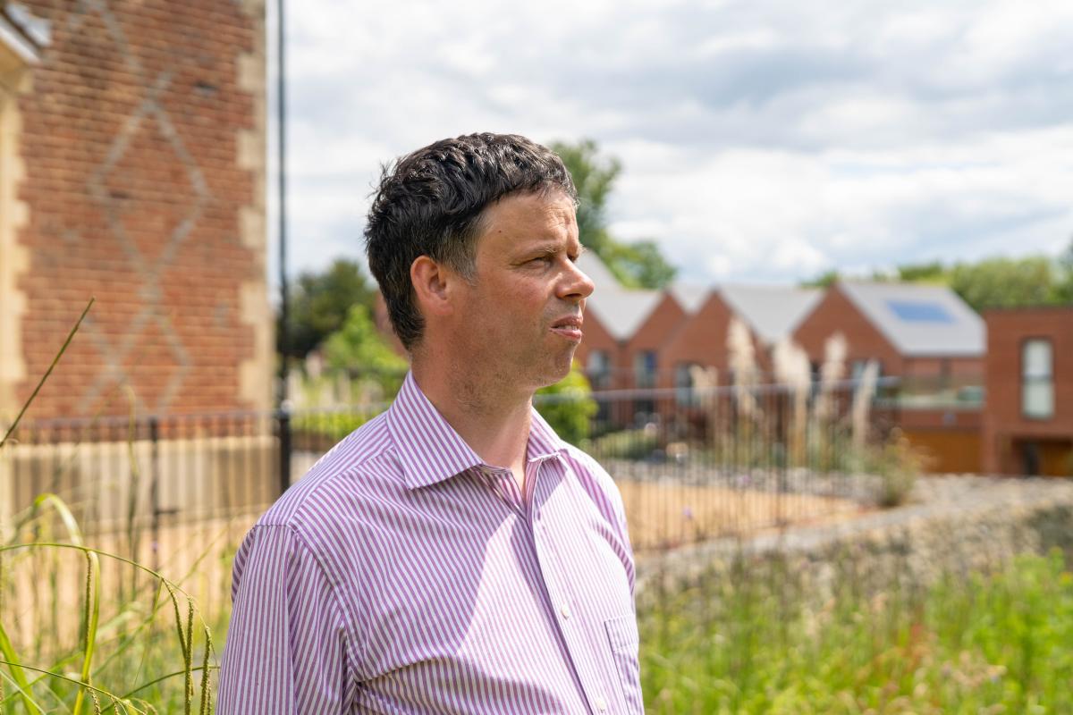 Scott Watkin standing in the garden at Redhill