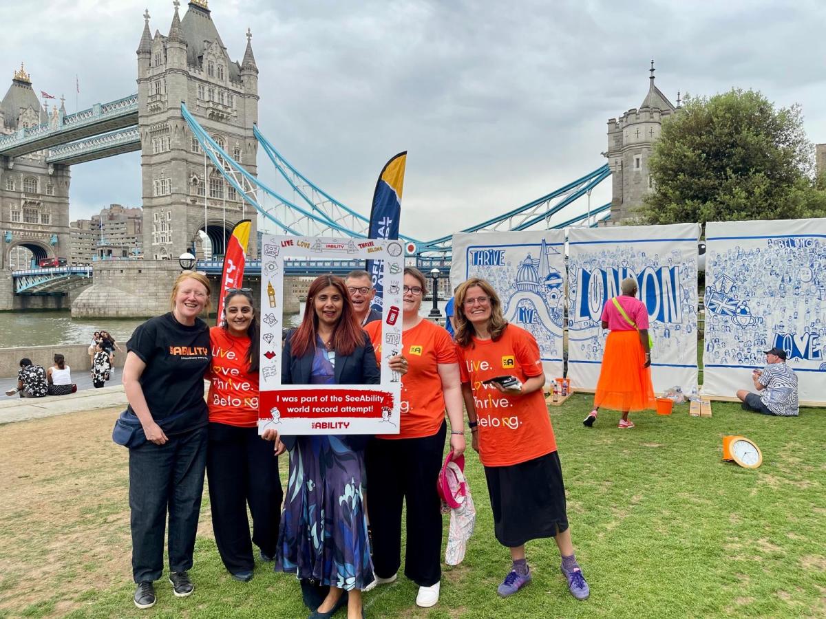 Marina Ahmad, London Assembly Member for Lambeth and Southwark, poses with colleagues alongside our record-breaking mural in Potters Fields Park
