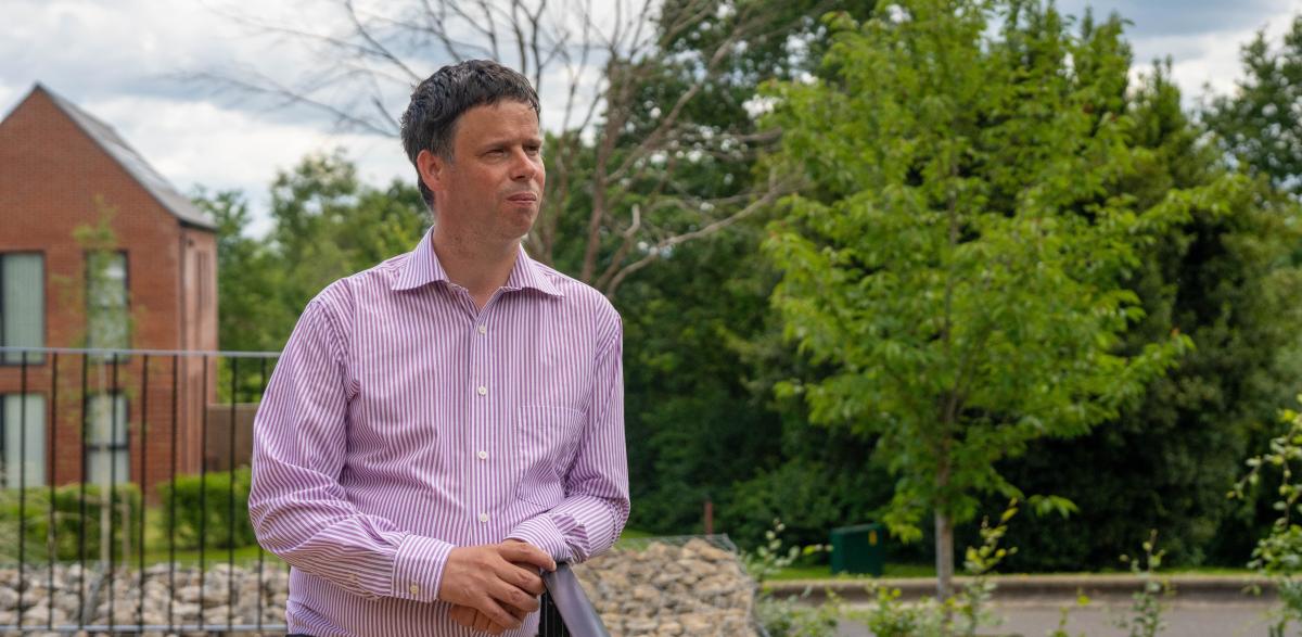 Scott Watkin standing in the garden at Redhill