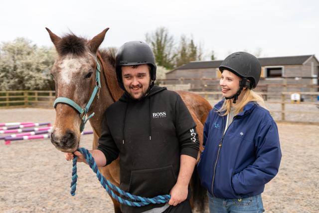 Charlie and his employment coach at HorseWorld