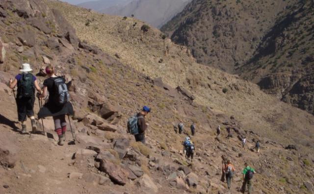 People trekking on the mountain in Toubkal