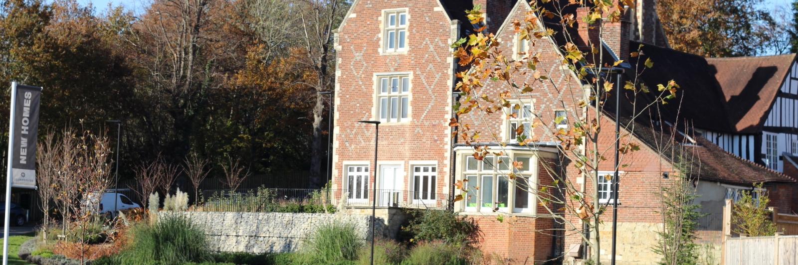 Exterior of Redhill supported living - a classic, Tudor-style building