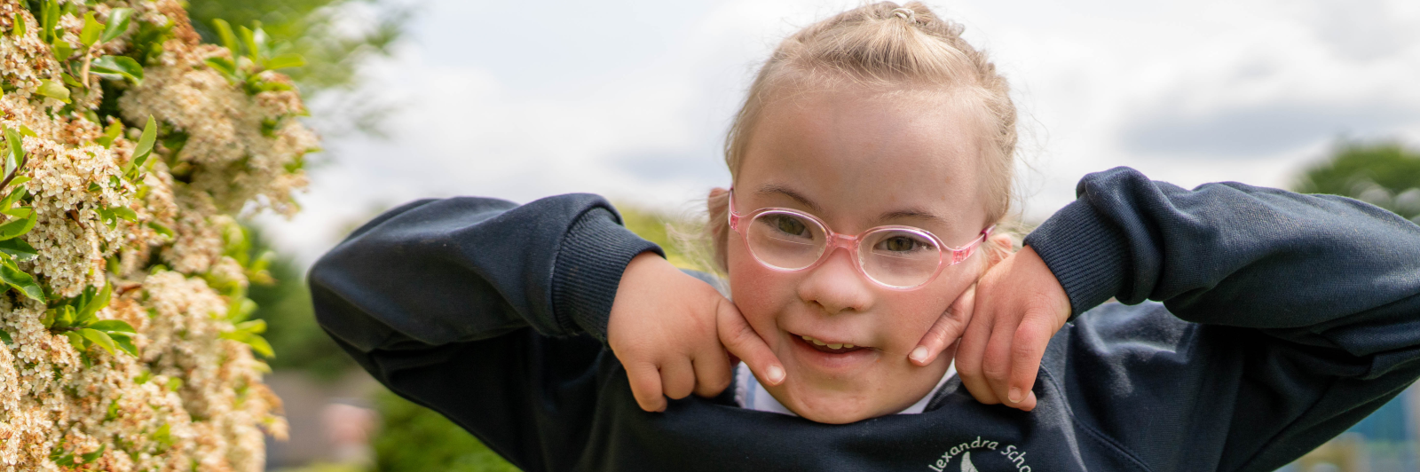 Ellie smiling outside