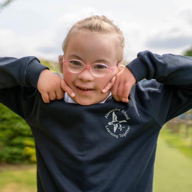 Ellie, a young girl wearing glasses