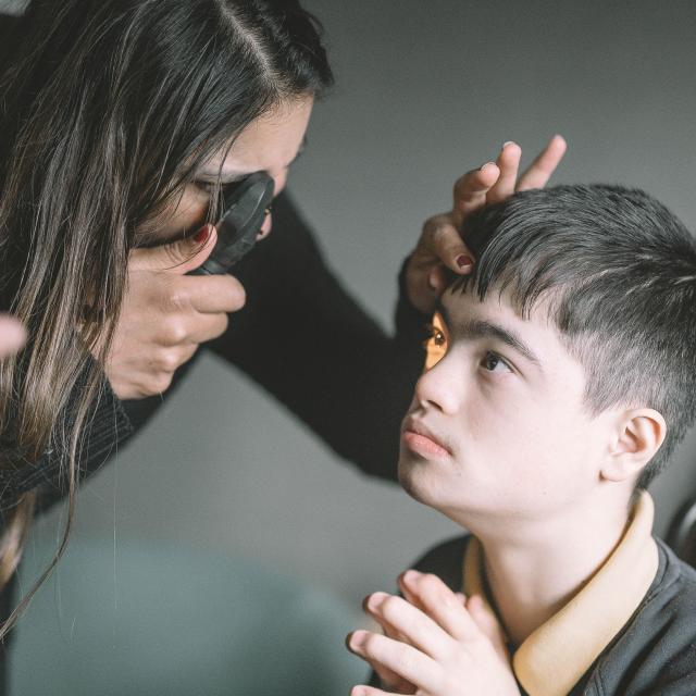 Malvi tests the sight of a young boy