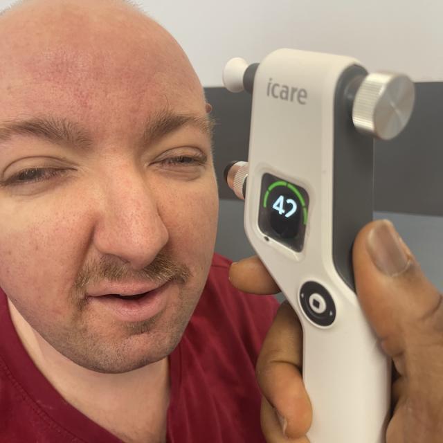Adam having an eye test