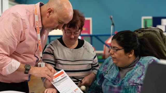 A SeeAbility eye care champion talks to people with learning disabilities.