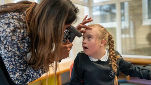 Ellie having her eyes tested in a school
