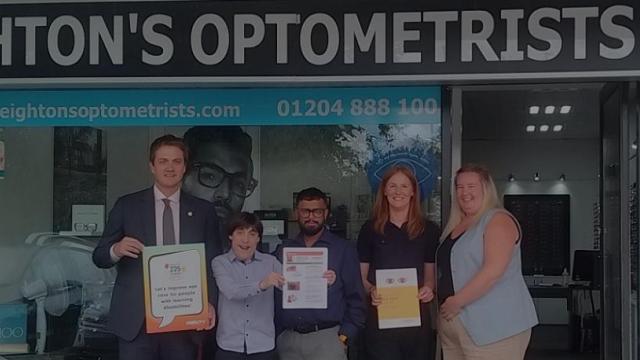 James Frith and the SeeAbility and Leightons teams outside the Opticians