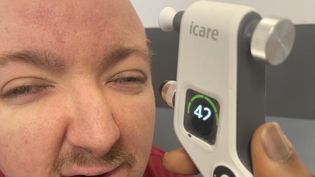 Adam having an eye test