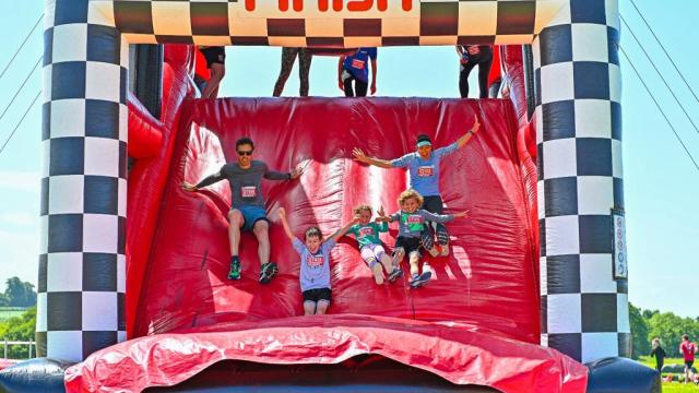 People running over an inflatable obstacle course