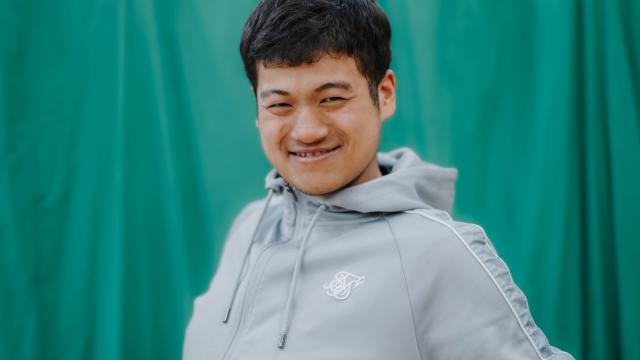 Giban smiling at the badminton court