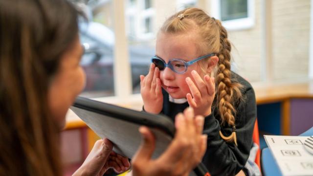 Malvi and Ellie doing an eye test in a special school